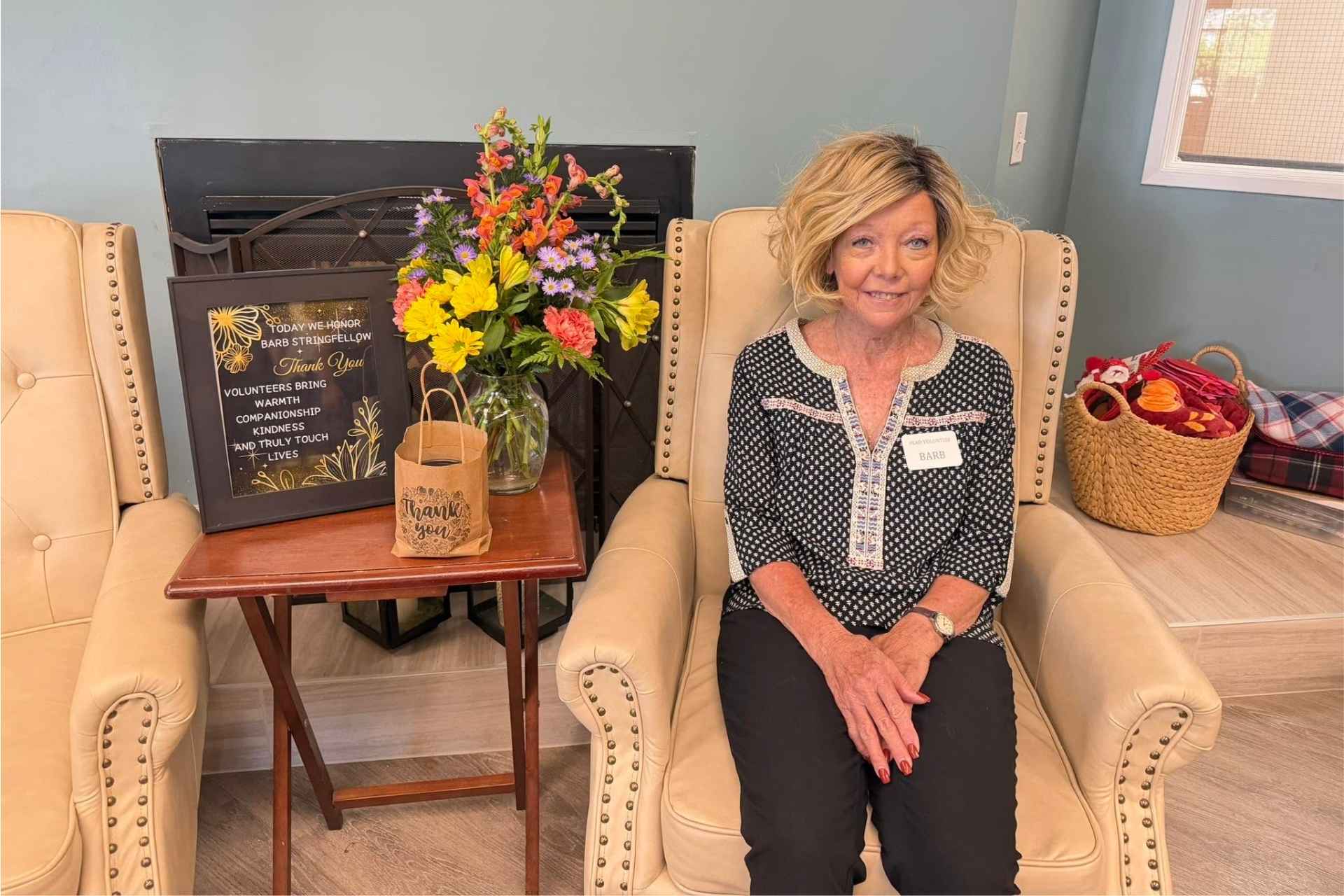 A woman being celebrated for her volunteer work with the community.